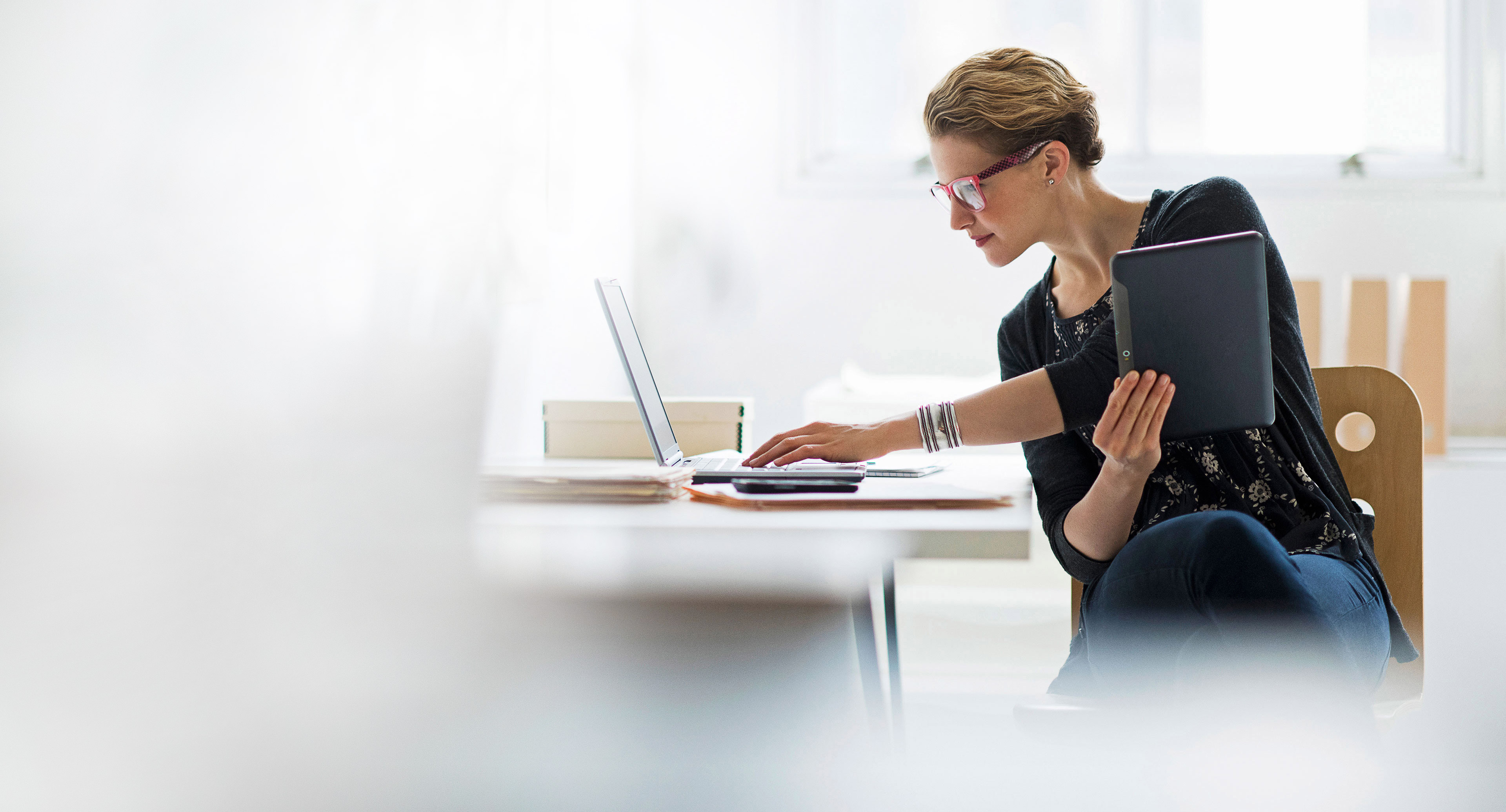 Business professional working at a laptop